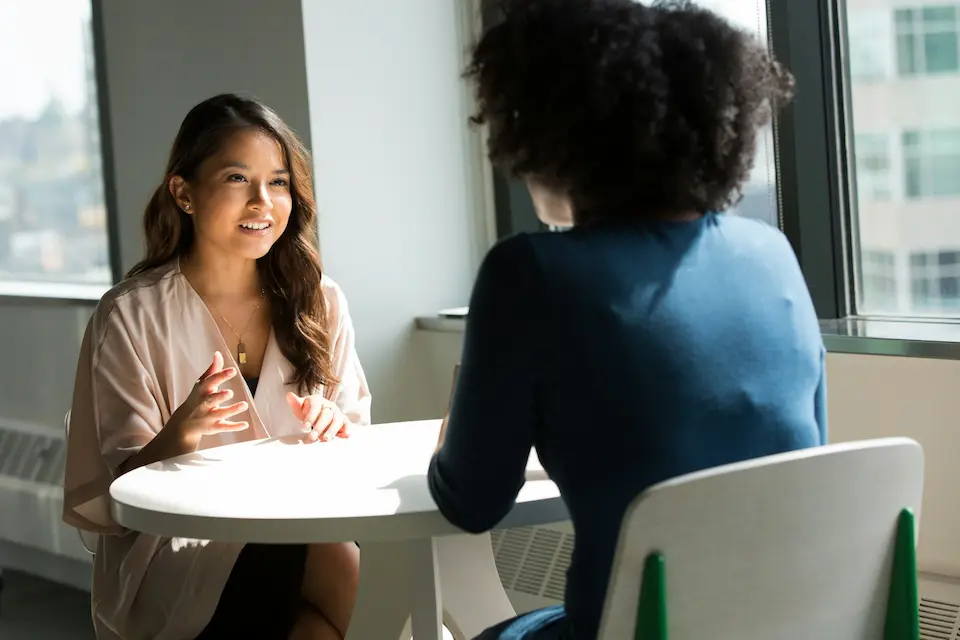 two women talking in spanish